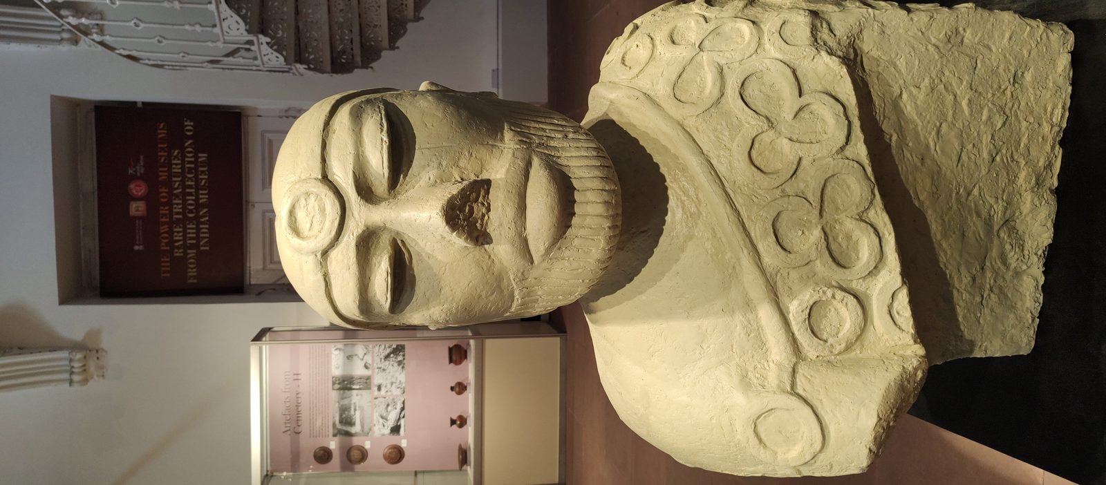 The so-called Priest-King sculpture of Mohenjo-daro: a small steatite bust of a bearded man wearing a patterned robe over one shoulder.