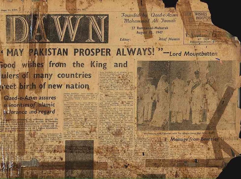 The front page of Dawn, worn and stained, with the headline May Pakistan prosper always and a photograph of a ceremony