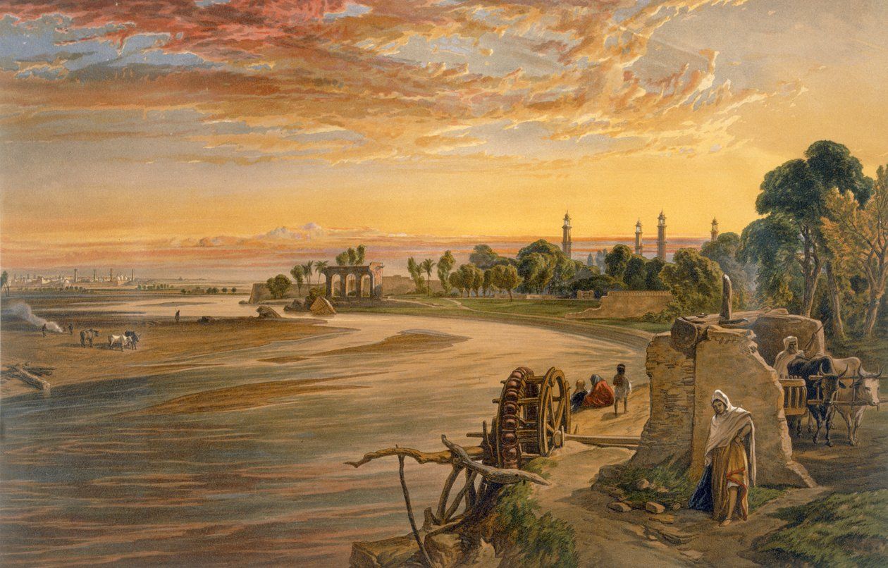 A colour print of a broad river at sunset under a fiery sky, with a ruined pavilion at the water's edge, minarets rising from trees on the far bank, and a Persian wheel and figures on the near bank.